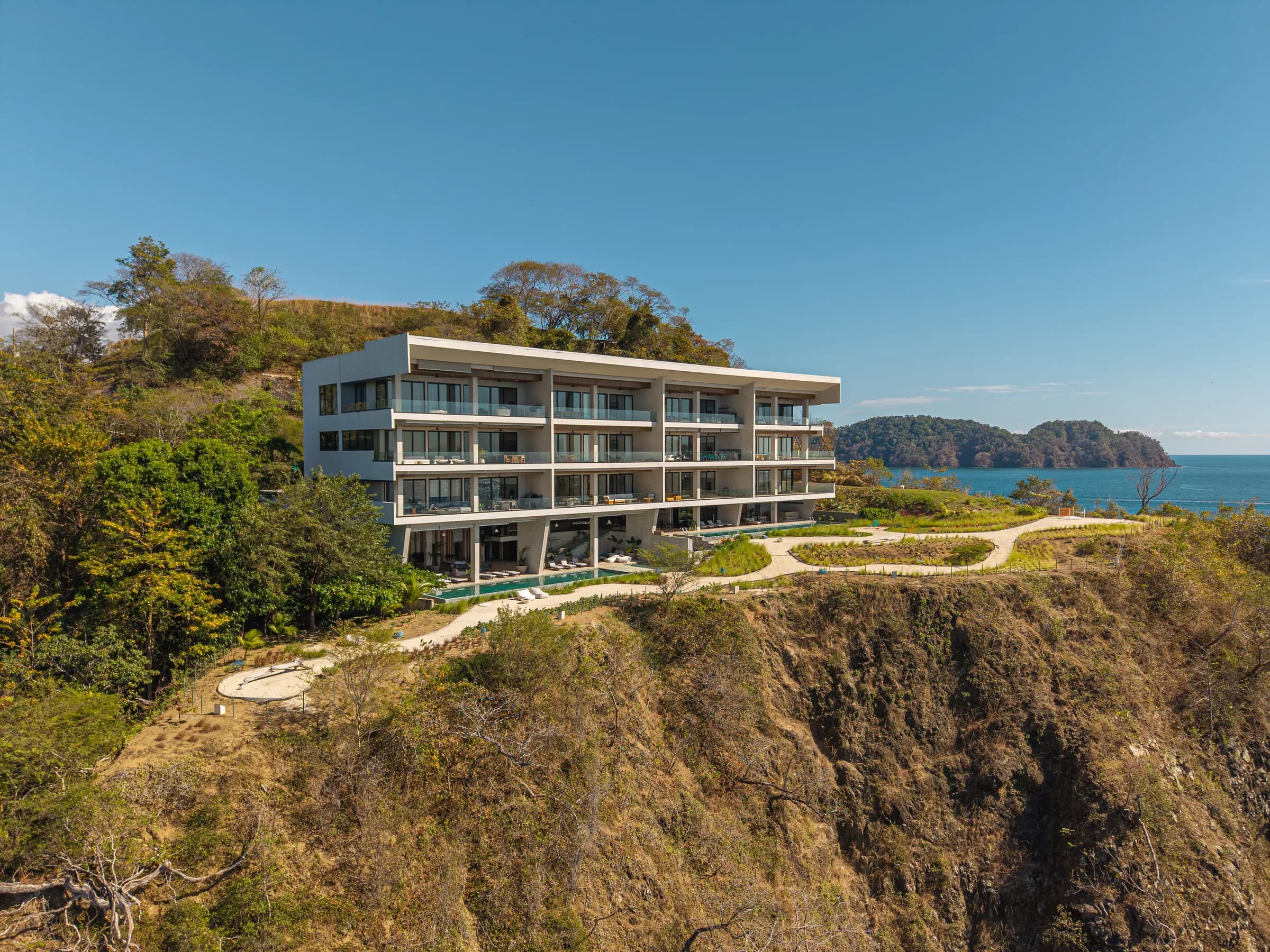 The Nerea building on the cliff with offshore islands beyond