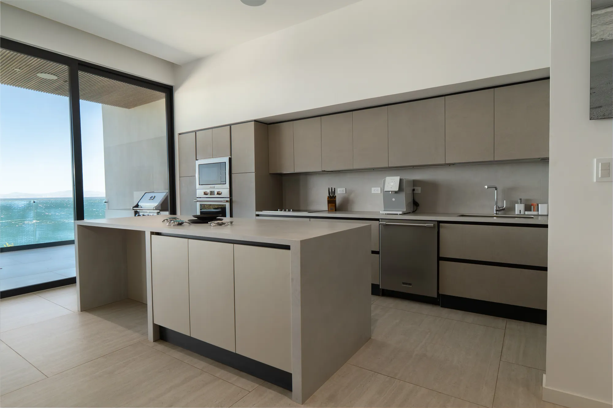 Concrete kitchen with sea view