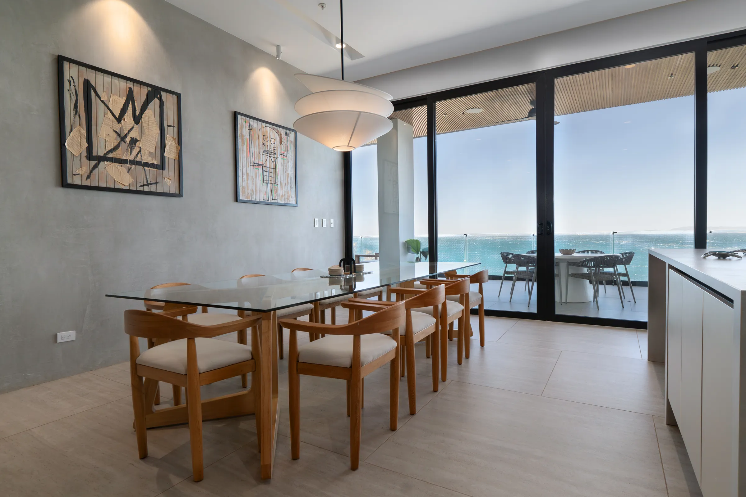 Dining room with art and ocean terrace